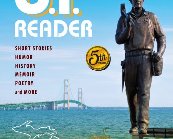 The cover of up reader with a statue in the background.