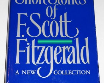 A blue hardcover book titled "The Short Stories of F. Scott Fitzgerald: A New Collection," edited and with a preface by Matthew J. Bruccoli. The dust jacket shows minor wear along the edges.