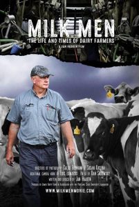 A man in a blue shirt and cap stands in front of a group of dairy cows, some with yellow ear tags. The title "Milk Men: The Life and Times of Dairy Farmers" and film credits appear at the top and bottom of the image.
