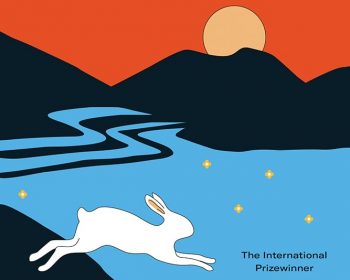 Book cover for "The Home of the Drowned: A Novel" by Elin Anna Labba, featuring a white hare leaping over blue water with small yellow stars, mountains, and an orange sun in the background.