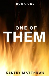 Book cover with flames at the bottom. The text reads: "BOOK ONE," "ONE OF THEM," and "KELSEY MATTHEWS." The background is black with orange and yellow fire at the lower half.