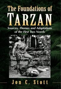 Book cover titled “The Foundations of Tarzan” by Jon C. Stott. It features a black-and-white image of a man in a loincloth standing with one foot on a lion’s head, surrounded by jungle foliage.